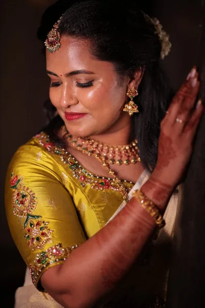 Close-up of an embroidered gold bridal blouse